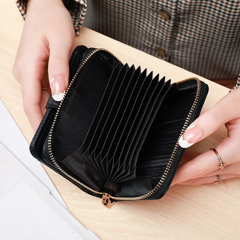 Women's solid colour short wallet with lychee pattern and sewing thread detail in multiple colours.