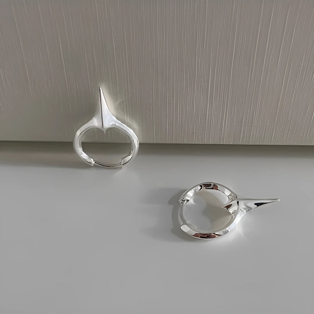 Geometric star-shaped copper ear clip with white gold electroplated finish