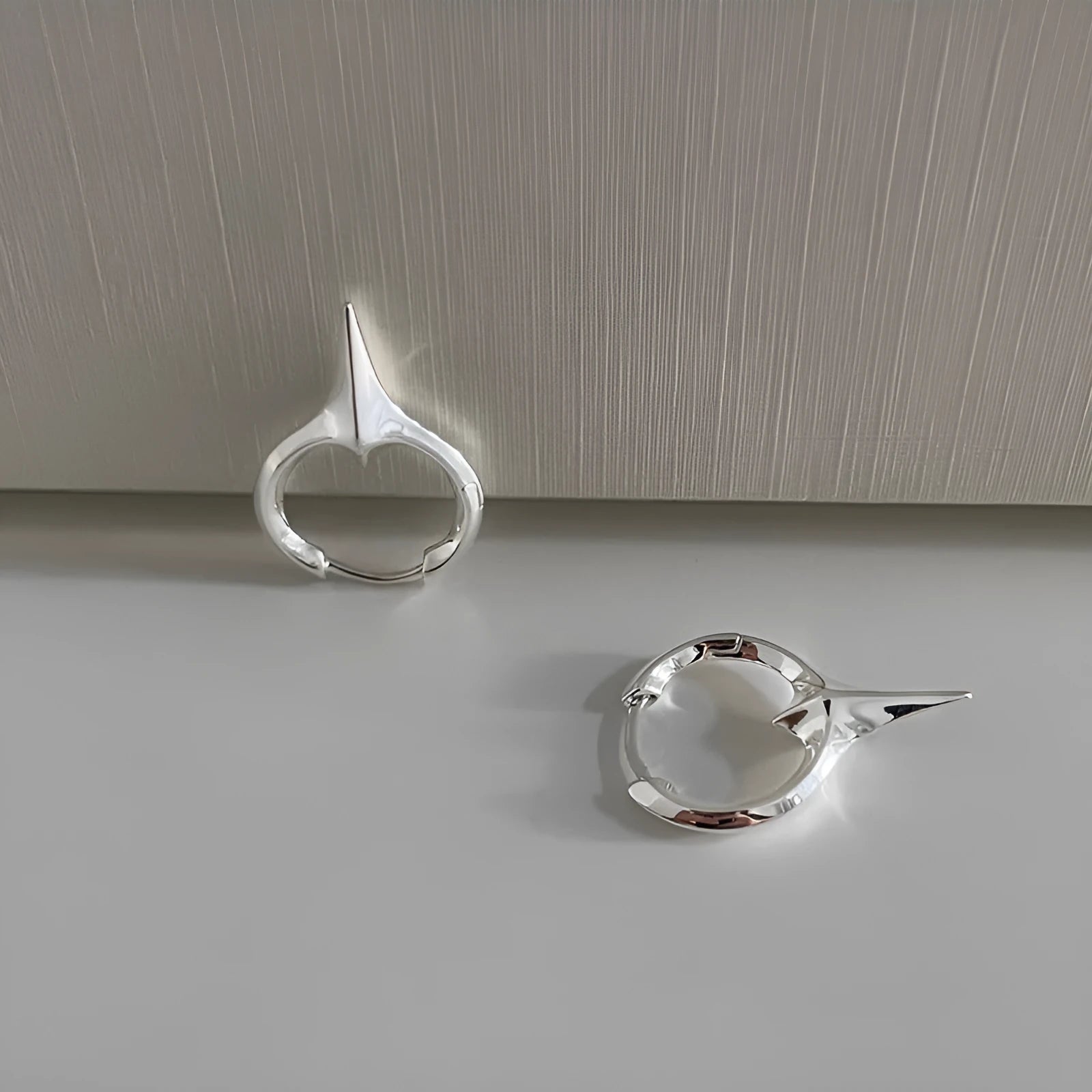 Geometric star-shaped copper ear clip with white gold electroplated finish