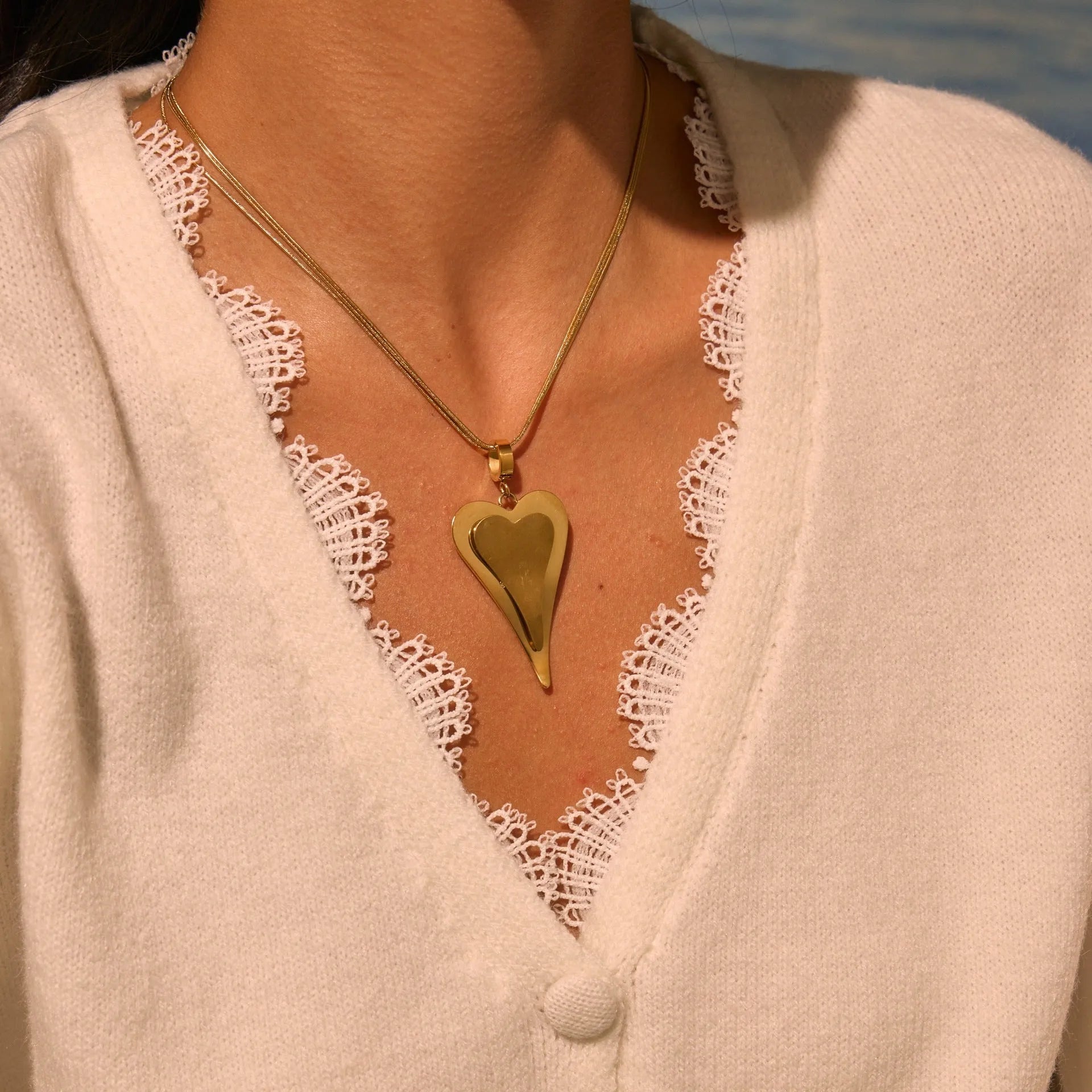 Geometric double heart pendant necklace with snake bones chain pattern in stainless steel