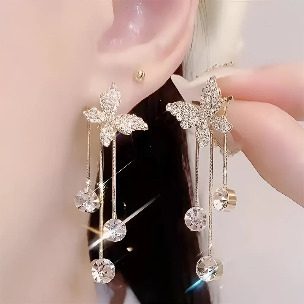 Silver butterfly rhinestone drop dangle earrings with pearl tassel chain and heart elements on alloy