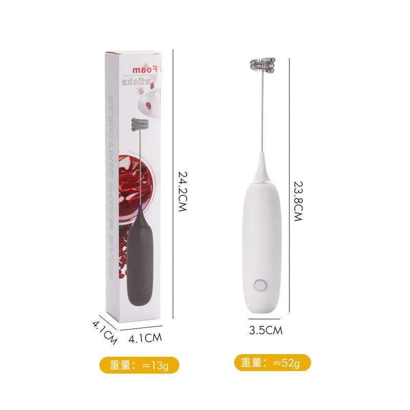 Electric hand-held milk frother in black and white colours for coffee preparation