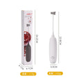 Electric hand-held milk frother in black and white colours for coffee preparation