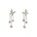 Silver butterfly rhinestone drop dangle earrings with pearl tassel chain and heart elements on alloy