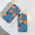Retro orange and blue plastic back cover case for iPhone models on a table.