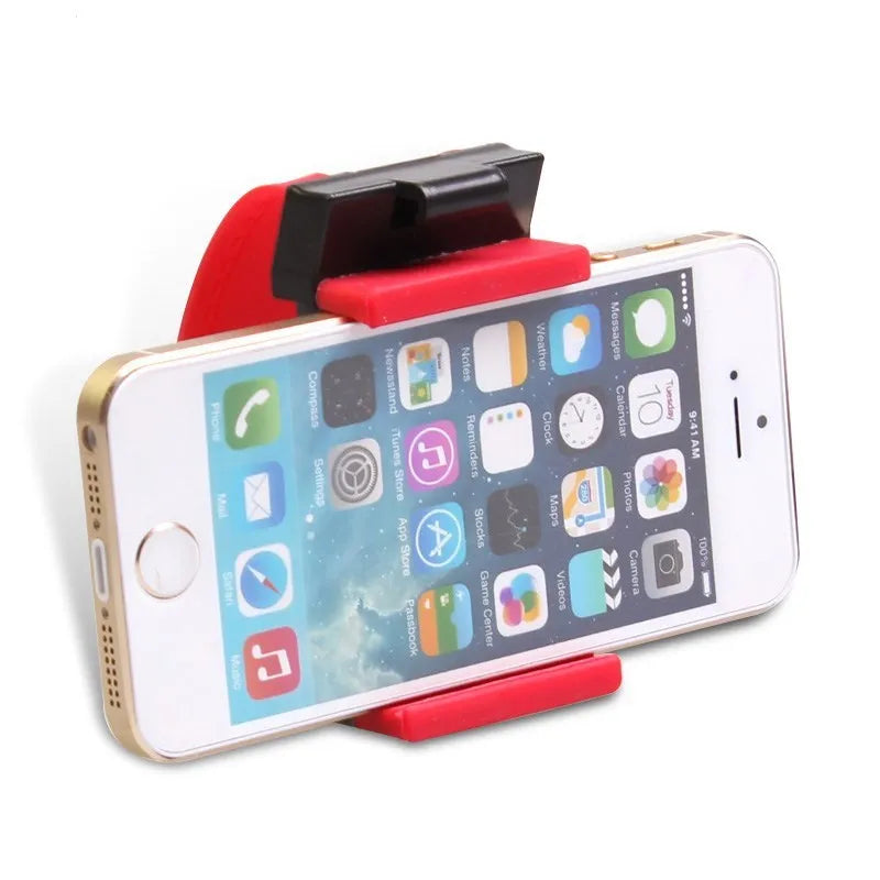 Black steering wheel phone clip mount holding smartphone with soft silicone padding visible