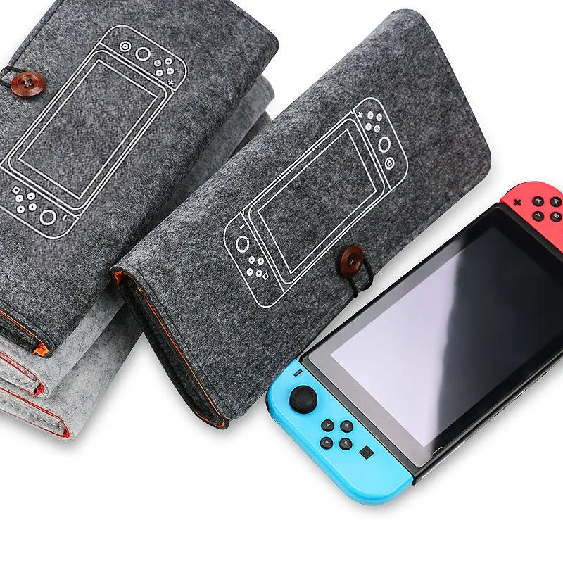 Black felt Nintendo Switch carrying case showing game card slots and storage compartments