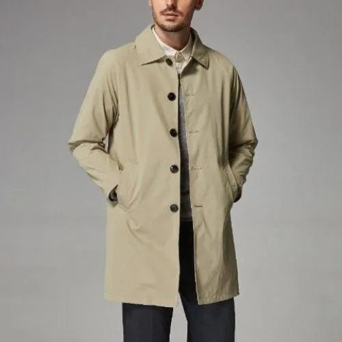 Man wearing a mid-length khaki loose-fit casual trench coat made of rabbit fur.