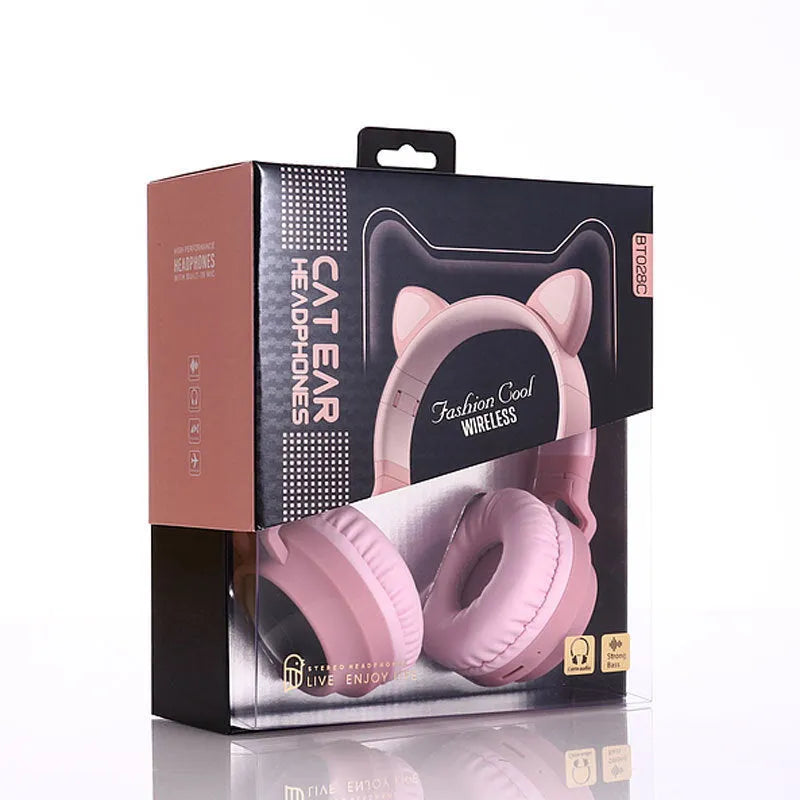 Cute Bluetooth 5.0 wireless headset in pink, foldable design with padded ear cups and 3.5mm audio port