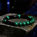 Natural obsidian stone bead bracelet with constellation design in 8mm size on wrist