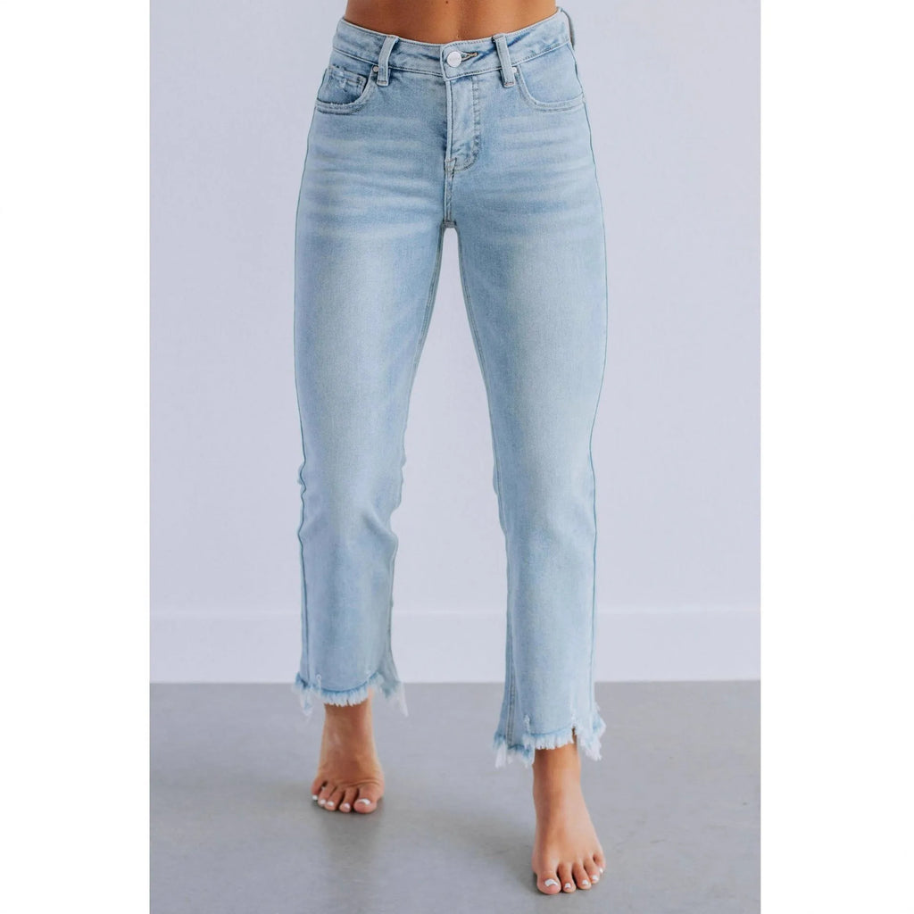 Women's solid colour cotton denim jeans with hand-worn detailing in dark blue and light blue.