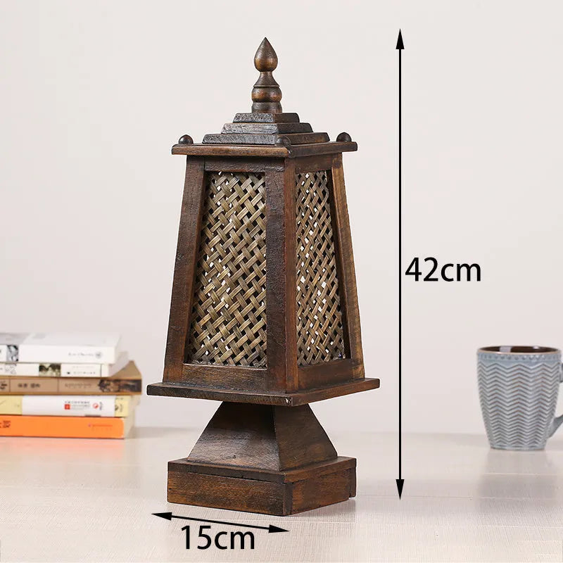 Retro wood table lamp with hand-woven straw rattan lampshade on a desk