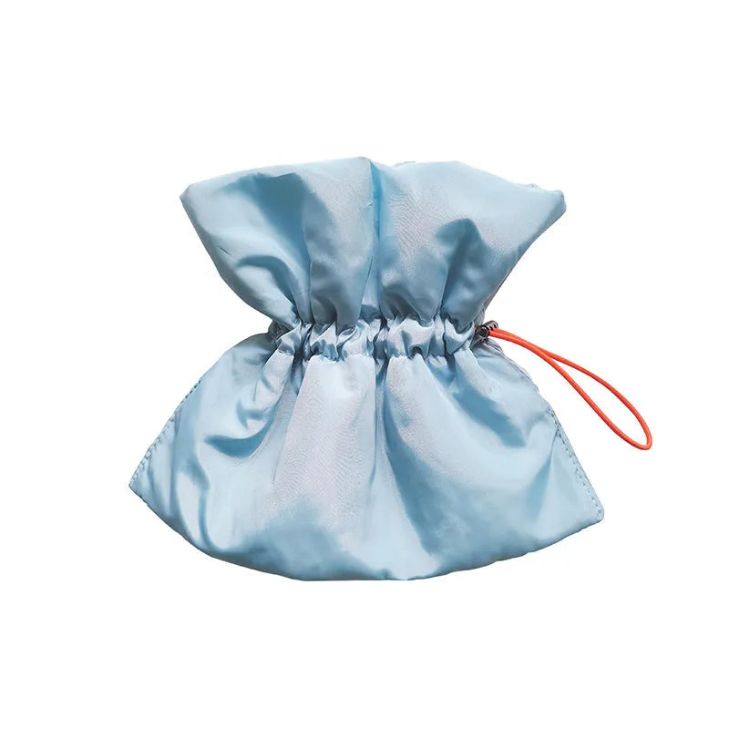 Soft adjustable polyester cat recovery collar in light blue shown on a model.