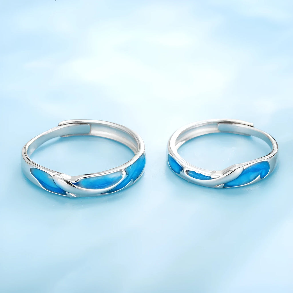 Silver adjustable couple ring with dolphin motif simple style on surface