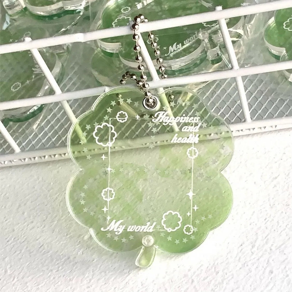 Acrylic four-leaf clover mobile phone pendant charm in blue, green, or mint colour options