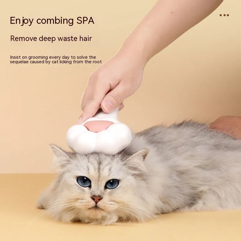 White plastic cat paw pet comb with massage action and one-click hair removal function