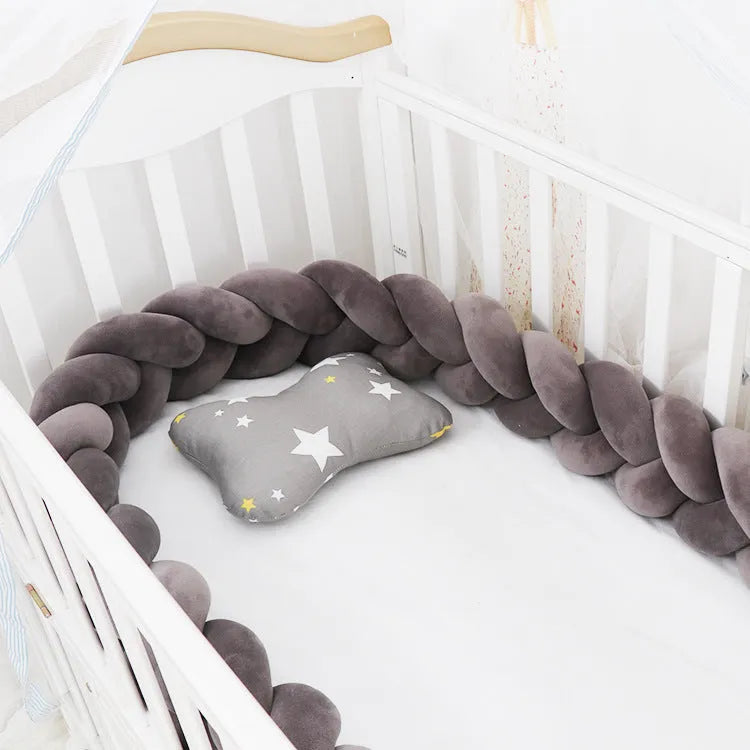Baby crib bumper braid knot pillow cushion in spandex velvet fabric, shown in a multi-colour option.