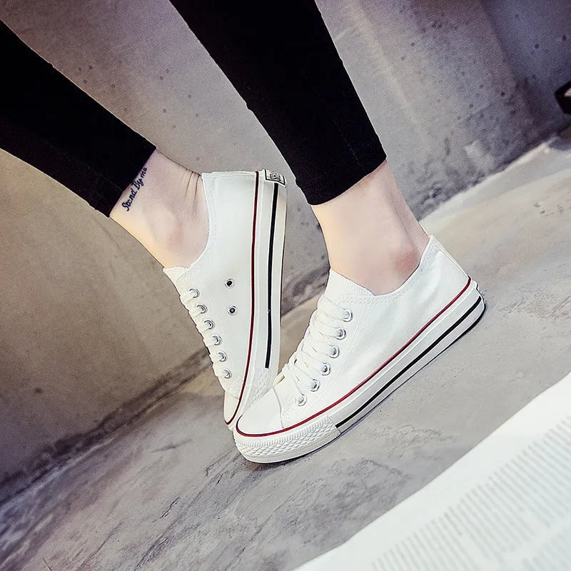 Women's solid colour canvas casual shoes in black, white black, white red and all black colour options.