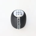 Sewn wrapped perforated leather gear handball for Toyota Alpha in matte and silver finishes.