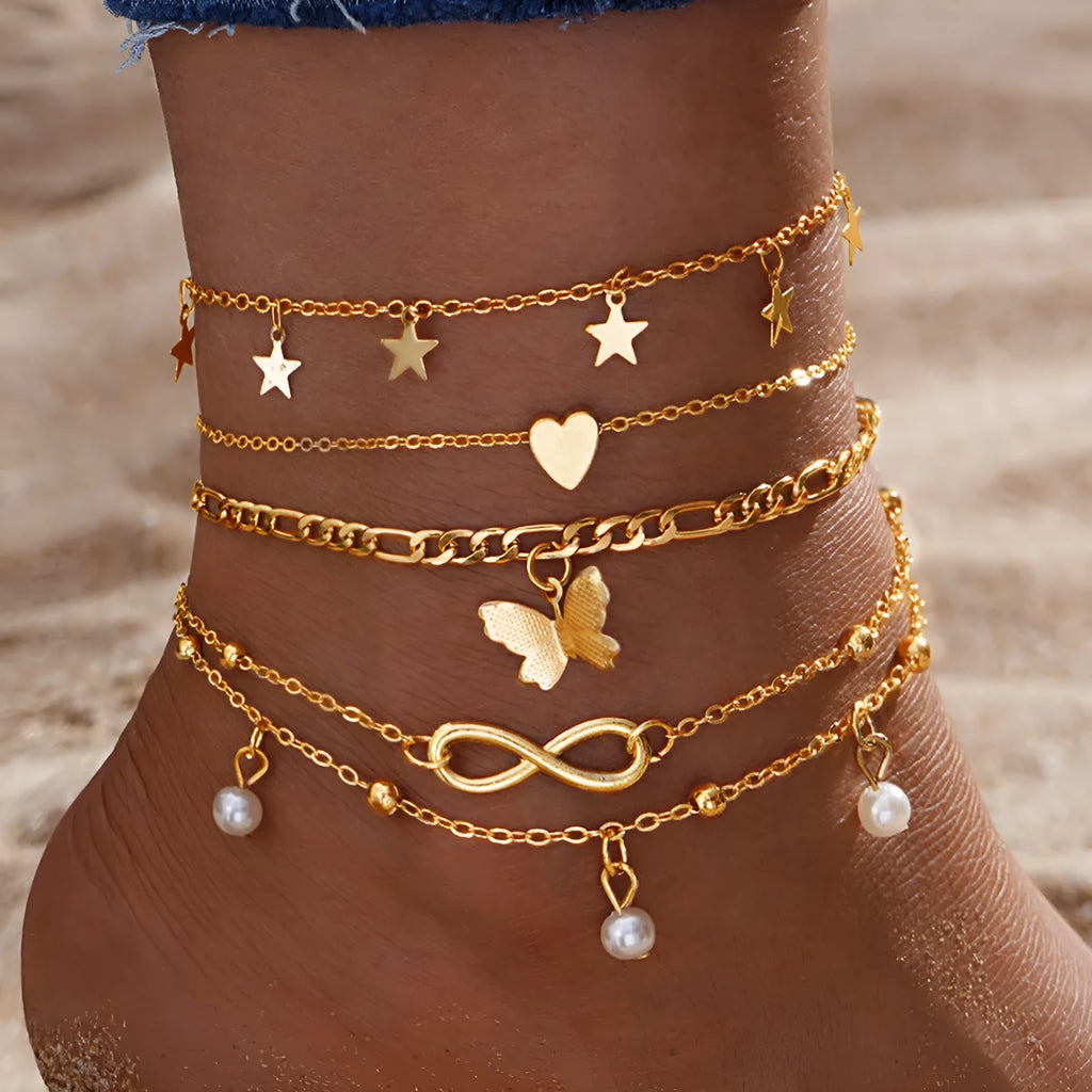 Four-piece women's anklet set with butterfly and pearl heart designs in alloy