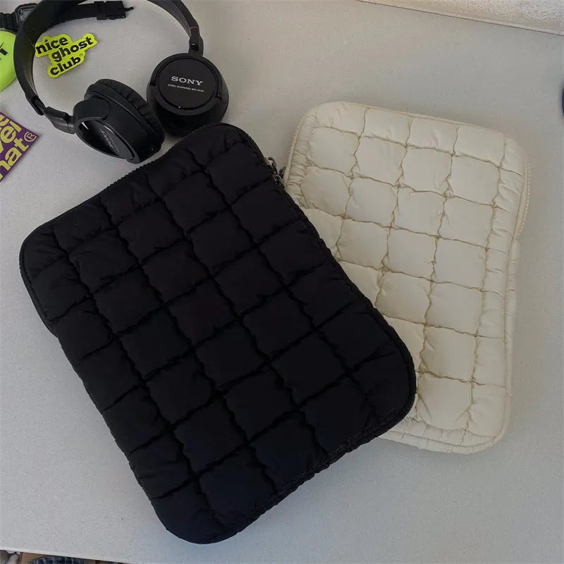 Large capacity laptop bag in black or white with durable nylon exterior and cloud cotton interior