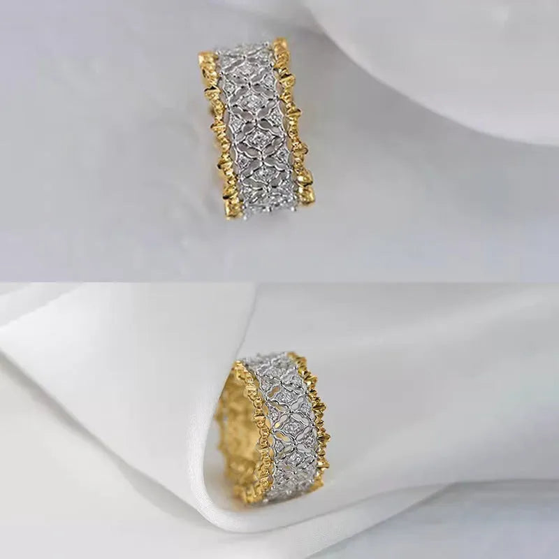 Gold and silver two-tone geometric ring with a central round zircon stone on a copper band.