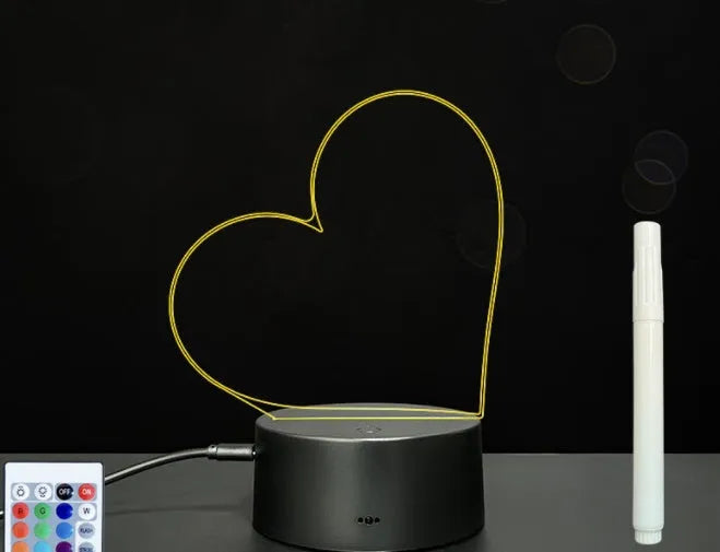 3D acrylic LED message board night light on a desk, showing illuminated surface and remote control
