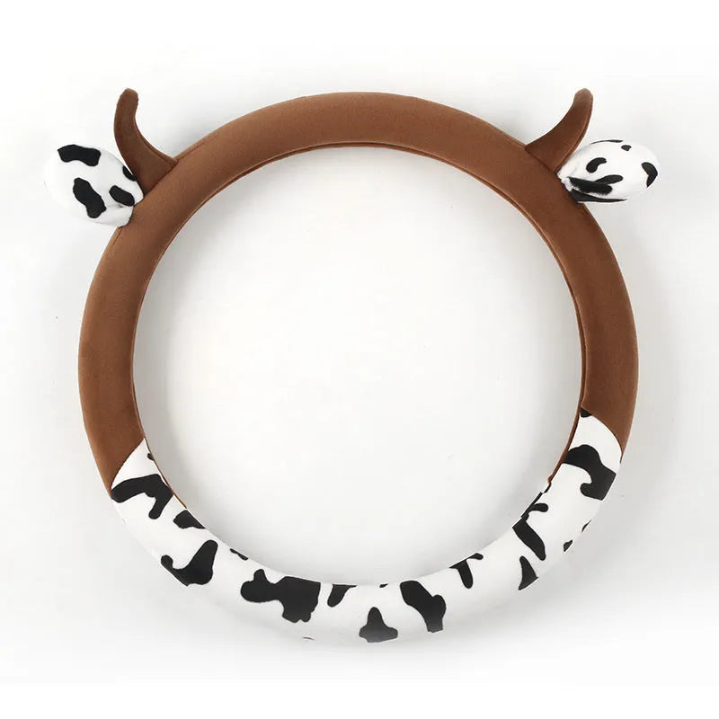 Short plush automotive steering wheel cover in black, showing protective handle detail.