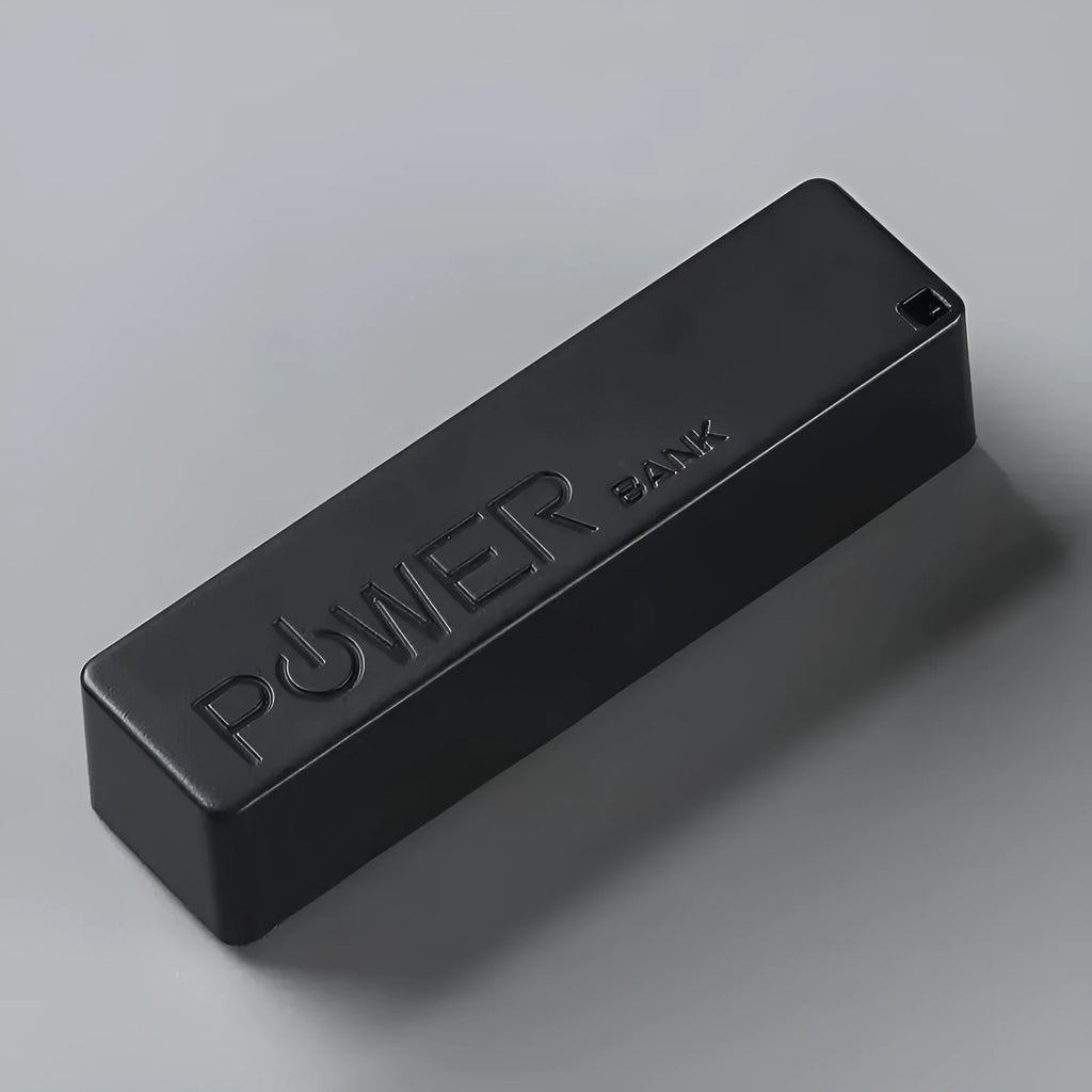 Compact white plastic power bank with wireless charging pad and built-in bracket stand