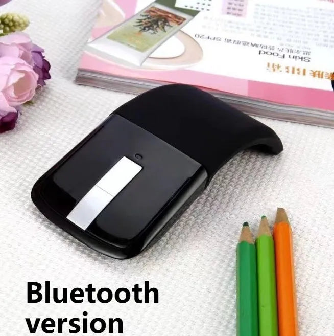 Folded Bluetooth wireless mouse showing compact size with touch surface and multiple colour options