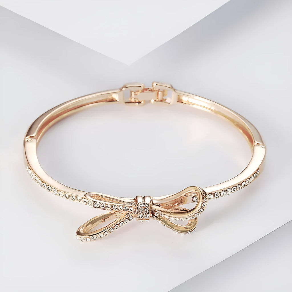 Rose gold electroplated copper women's bracelet with bow and diamond accents