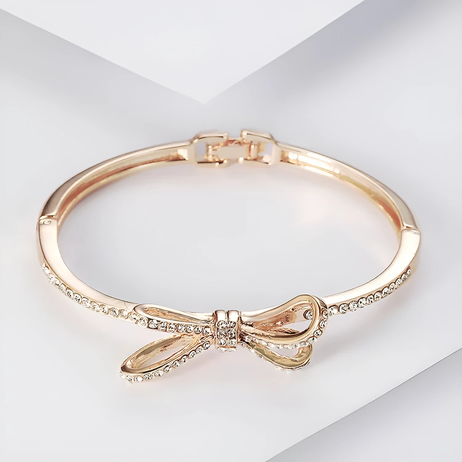 Rose gold electroplated copper women's bracelet with bow and diamond accents