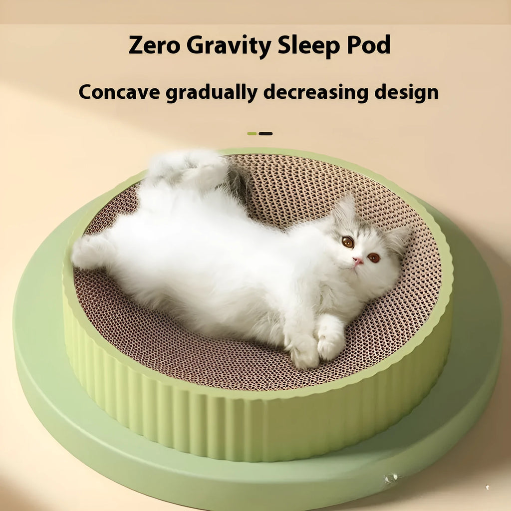 Green and white round cat scratching board with corrugated paper centre and raised nest edge.