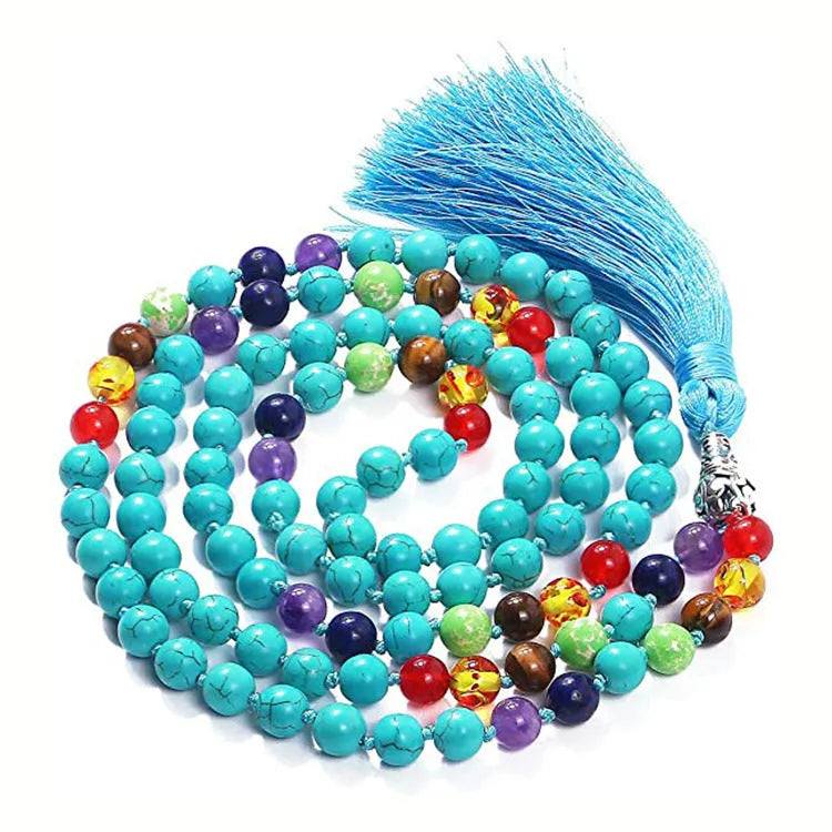 Long agate tassel necklace with geometric beads in multiple natural stone colours on a white background.