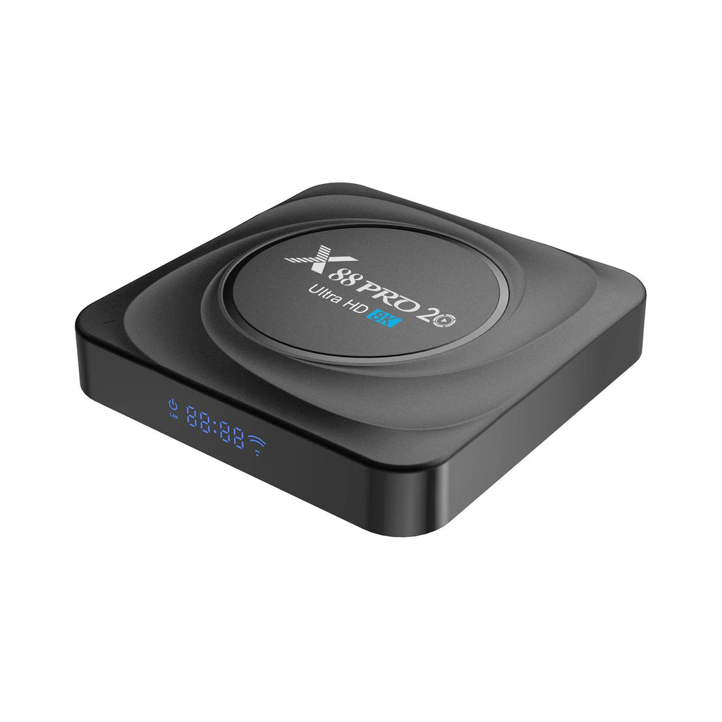 Compact black Android TV box with HDMI port, shown with remote control and power cable