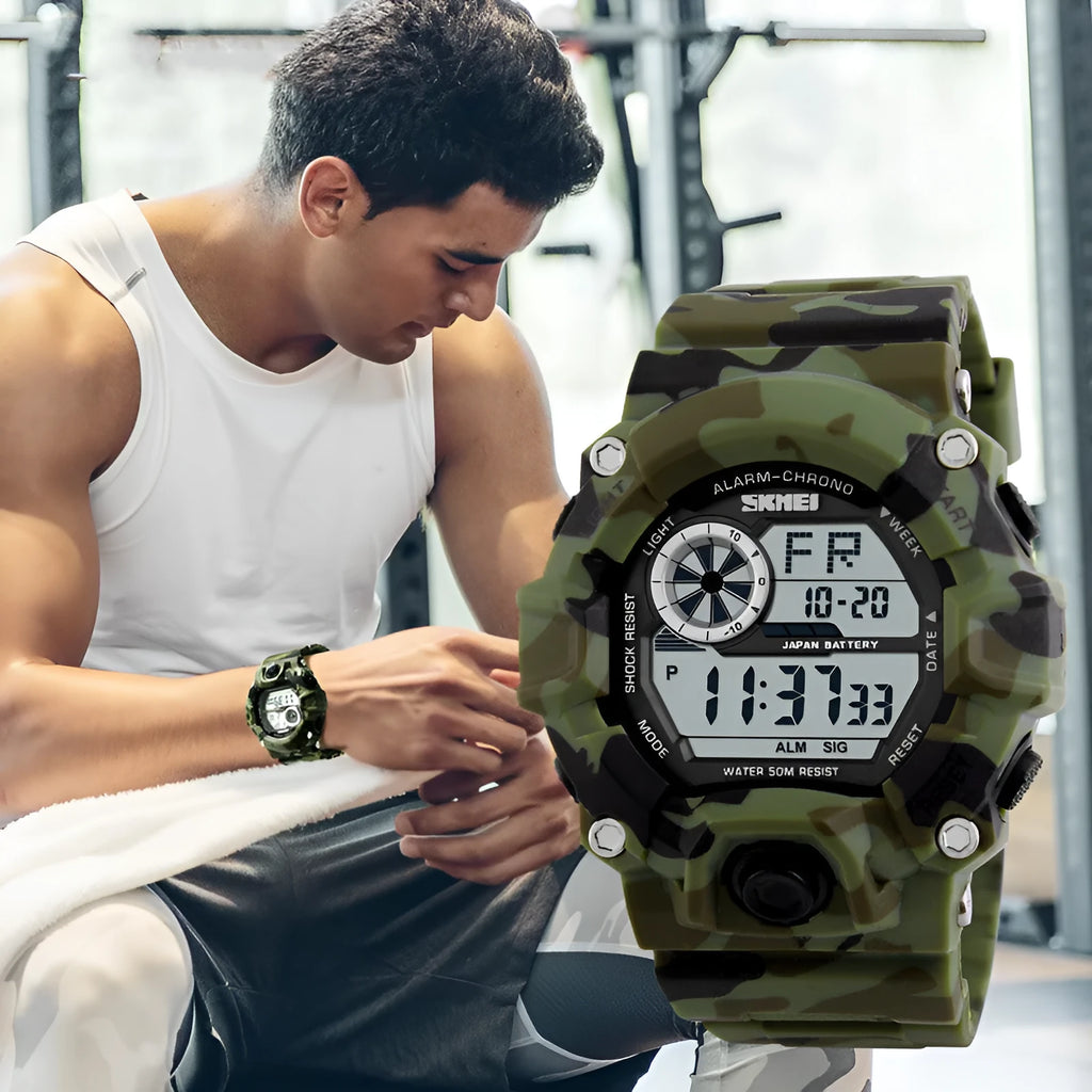 Round dial electronic sports watch with plastic strap, shown in army green colour, displaying time and date.