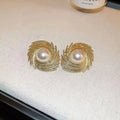 Women's vintage pearl earrings with exaggerated flower shape and electroplated alloy construction