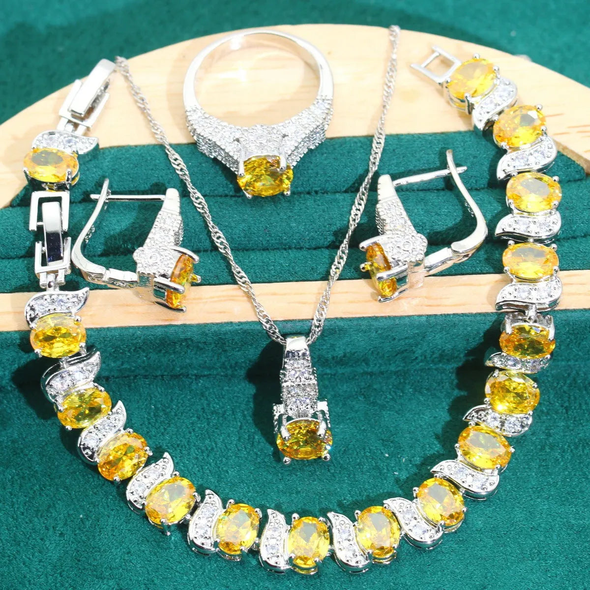 Four-piece bridal jewellery set with zircon alloy necklace, earrings, bracelet, and ring in water wave chain design