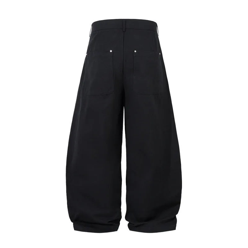Men's black cotton pleated machete trousers with wide legs and elastic mid waist