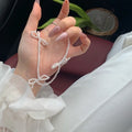 White imitation pearl necklace with bow pendant on adjustable 31-40cm chain