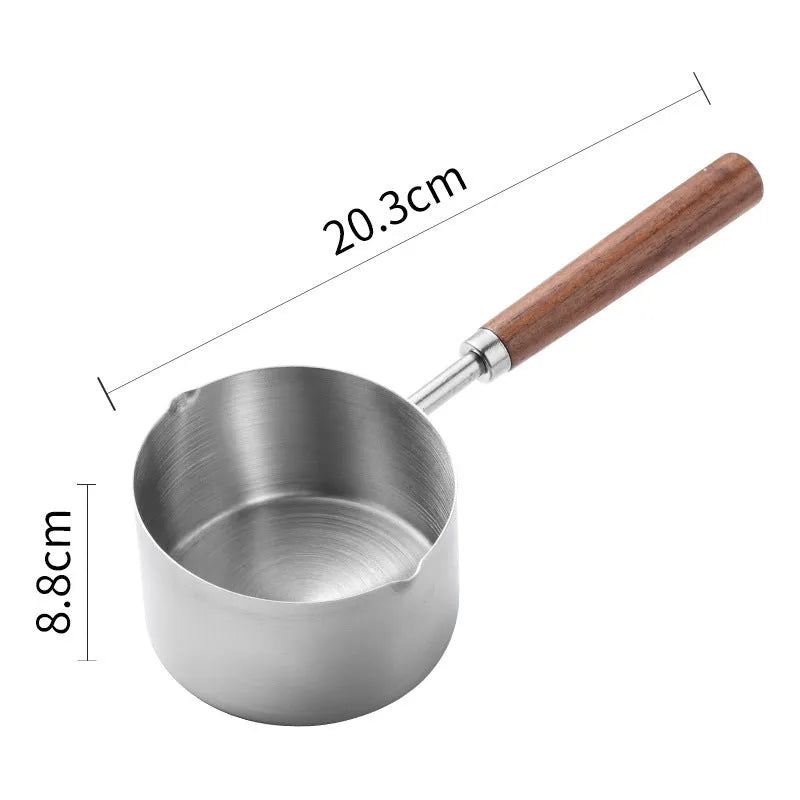 Two 304 stainless steel dog food scoops with wooden handles on a surface