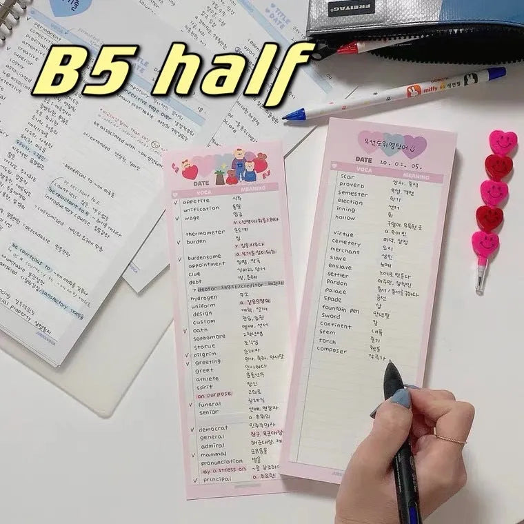 B5 half-size notepad with vertical English words printing in pink, purple, and blue cover colours.