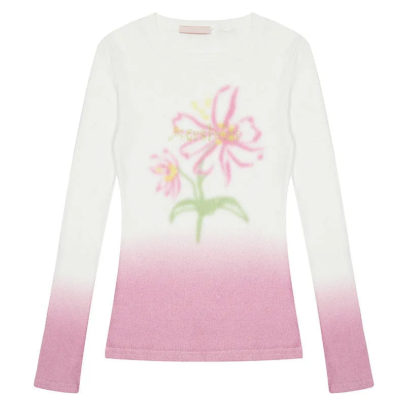 Women's yellow green gradient floral long-sleeved polyester T-shirt laid flat.