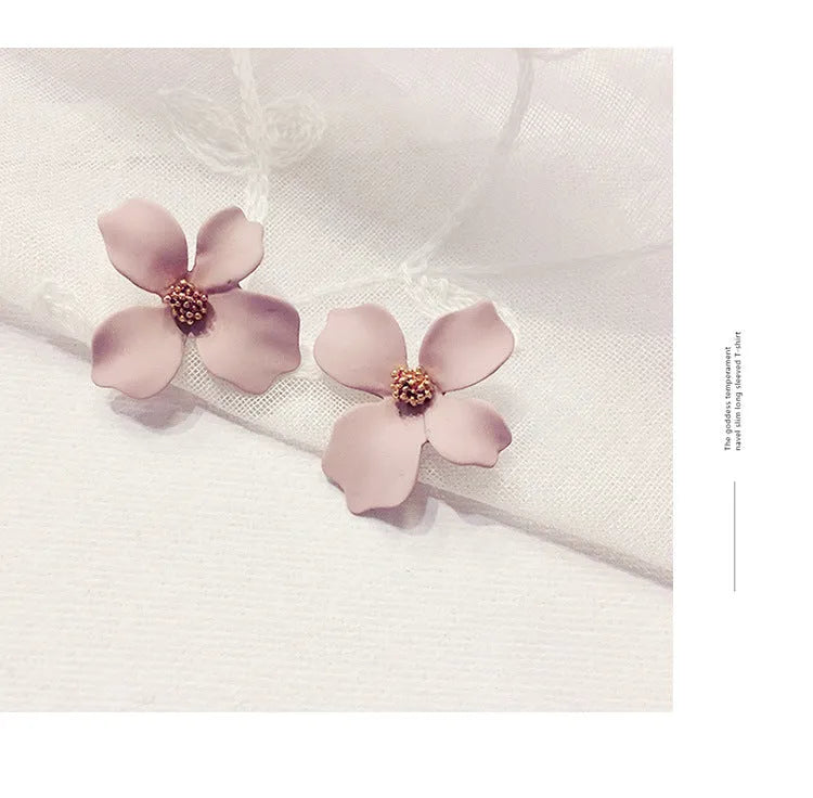Flower design stud earrings for women in white or pink electroplated finish