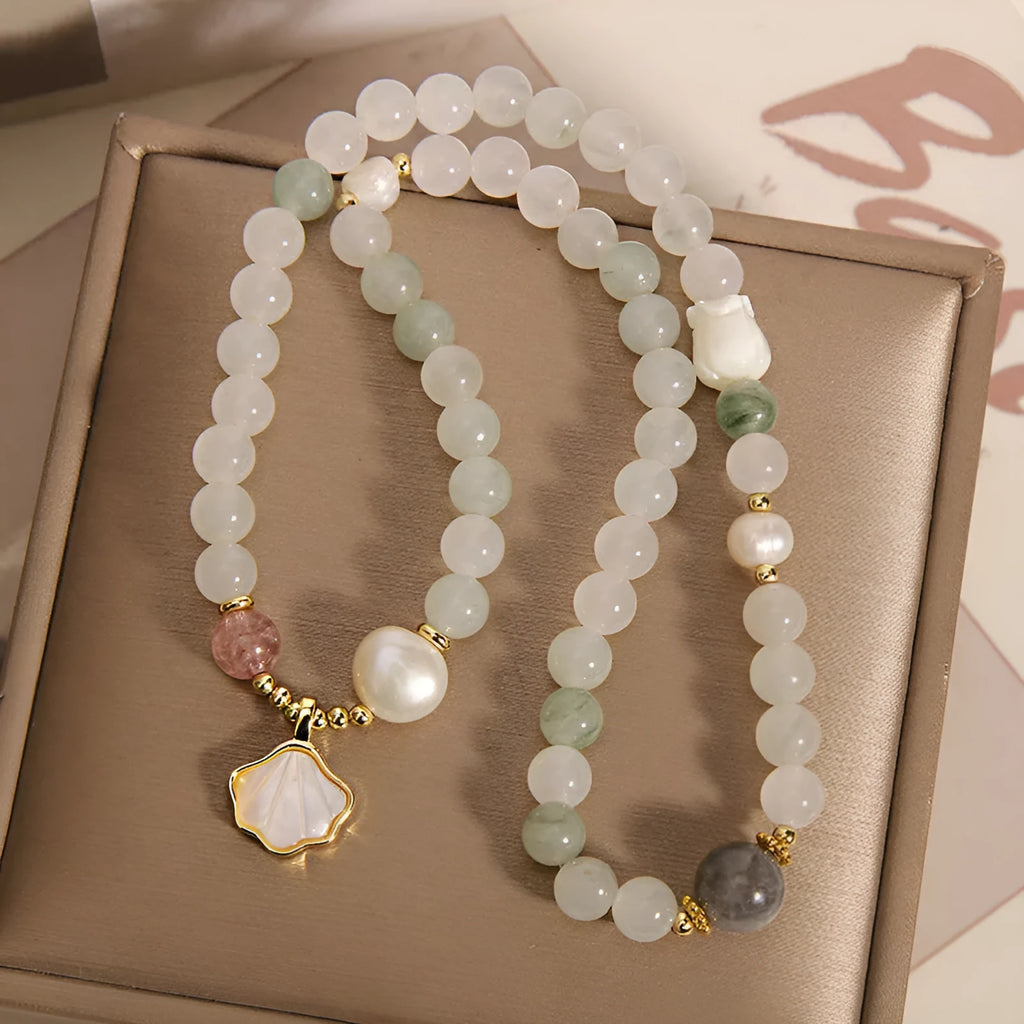 Tianshan emerald green crystal bracelet with gold-plated ginkgo leaf pendant and rhinestone accents