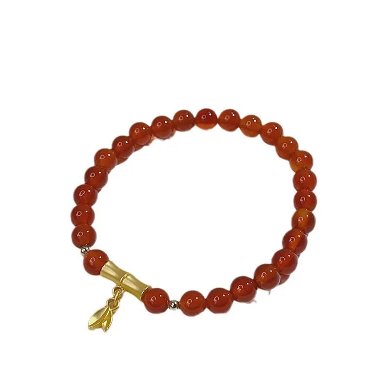 Handmade red agate bracelet with Chinese dragon design for women.