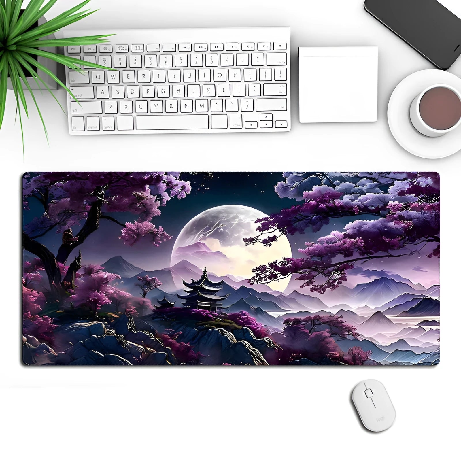 Large rectangular black gaming mouse pad with detailed pattern, shown on a desk with a keyboard.