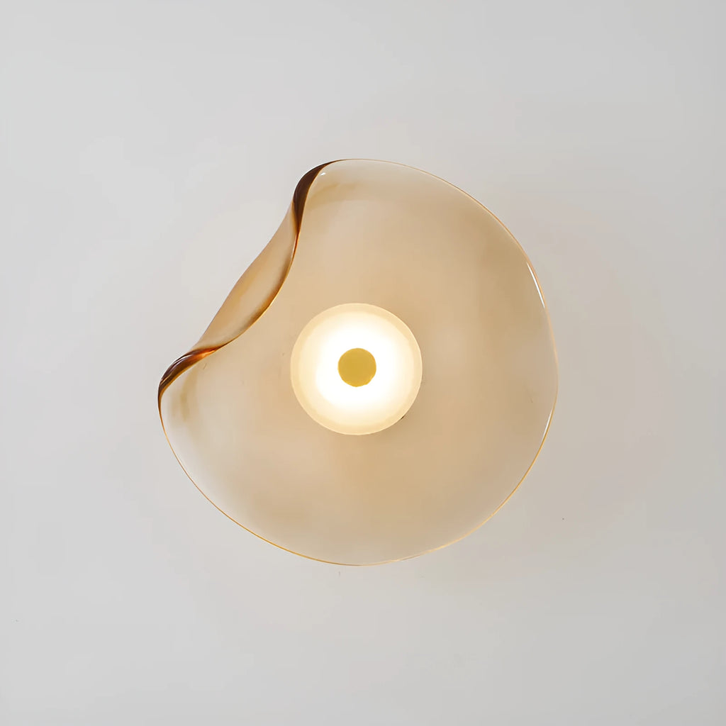 Round decorative wall lamp with glass shade in cognac colour for bedroom bedside lighting