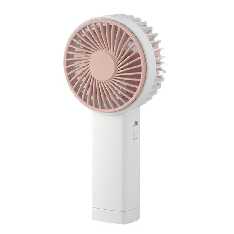 Outdoor portable USB rechargeable handheld fan in pink with three plastic blades and single speed button