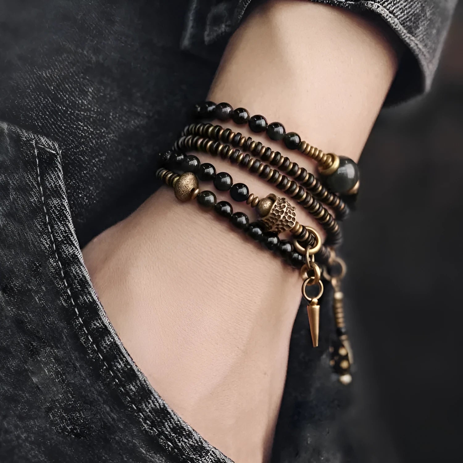 Black multi-layered beaded bracelet with geometric shapes and colourful retro patterns
